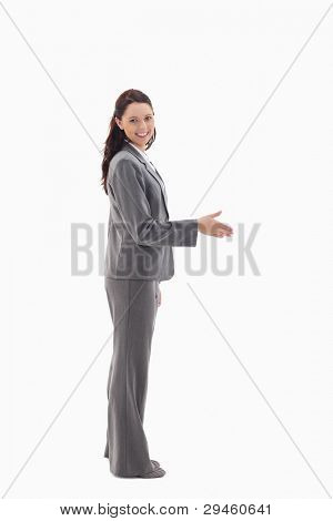 Profile of businesswoman smiling and shaking hands