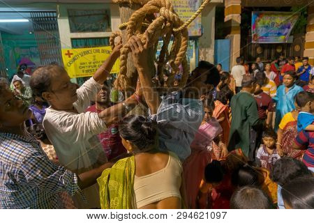 Howrah,west Bengal, India - April 15th, 2018 : Devotees Praying To Wood - During Gajan And Charak Pu