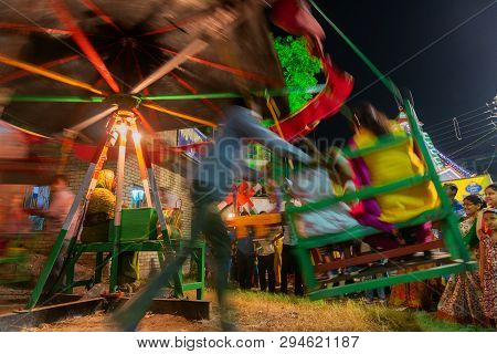 Howrah,west Bengal,india -april 15th, 2018 : Person Pushing Riding Children On Nagordola- A Traditio
