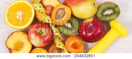 Tape Measure With Dumbbells And Fresh Healthy Nutritious Food As Source Natural Vitamins, Dietary Fi