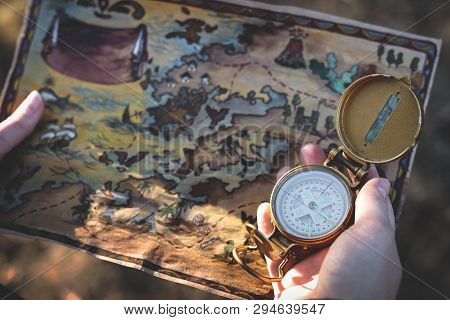 Treasure Map And A Compass On The Adventurer Map. Treasure Hunter Concept.