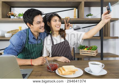 Shot Of Happy Young And Beautiful Asian Couple In Love Enjoy Sharing Coffee Break Together In Modern