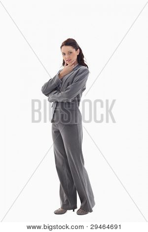 Profile of businesswoman with the hand on her chin against white background