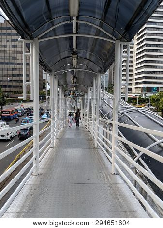 Jakarta, Indonesia - February 16, 2019: People Walking On The Hallway Of Sarinah Pedestrian Bridge O