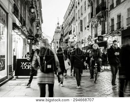 Paris, France - Mar 19, 2019: Defocused View Of Pedestrians Walking On The Iconic Pedestrian Rue De 