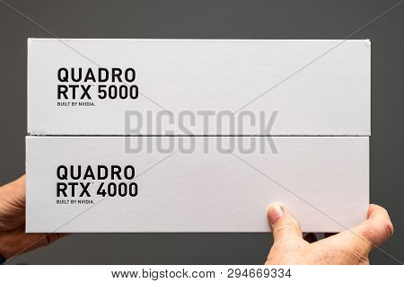 Paris France - Mar 28 2019: Senior Man Showing Two Cardboard Boxes Before Unboxing Of Nvidia Quadro 