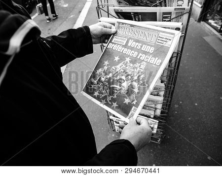 Paris, France - 29 Mar 2019: Newspaper Stand Kiosk Selling Press With Senior Male Hand Buying Latest