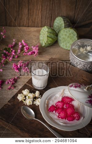Thapthim Krop, Mock Pomegranate Seeds In Coconut And Syrup In The White Bowl On The Wood Table There