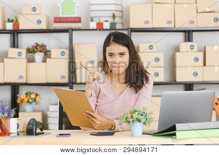 Shot Of Young And Beautiful Asian Business Lady In Casual Fashion Dress, Rechecking And Frowning On 