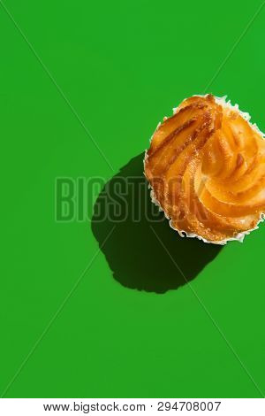Traditional Italian Pastry Zeppole On Solid Green Background. Harsh Light Hard Shadows. Top View Fla