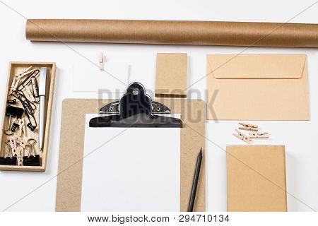 Folder, Boxes, Envelope And Other Office Suplies On A White Desk