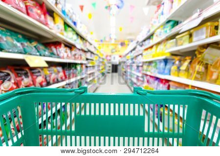 Closeup Shopping Basket Green Color With Blurred Suppermarket Background