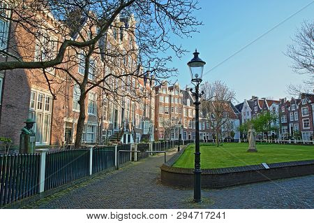 Amsterdam, Netherlands - April 05, 2019: The Internal Courtyard Of Begijnhof, One Of The Oldest Hofj