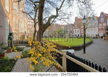 Amsterdam, Netherlands - April 05, 2019: The Internal Courtyard Of Begijnhof, One Of The Oldest Hofj