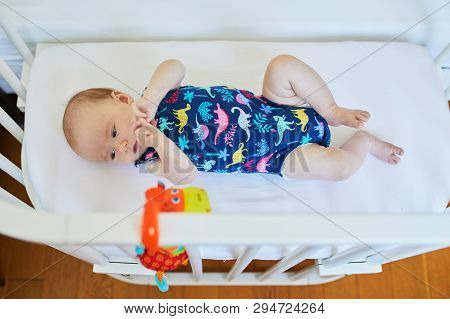 Baby Girl In Co-sleeper Crib