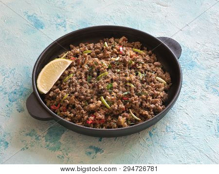 Indian Minced Meat Qeema On A Blue Table. Close Up.