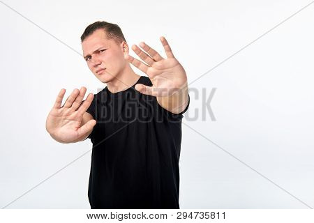 Body Language. Young Unhappy Man Showing A Gesture Of Denial Or Stop. Concept Of Rejection, Denial, 
