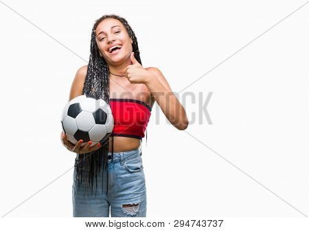 Young braided hair african american with birth mark holding soccer ball over isolated background happy with big smile doing ok sign, thumb up with fingers, excellent sign