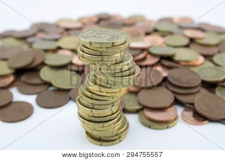 Unstable Economy. Stack Twenty Euro Cent Coins On More Coins Of Little Value.