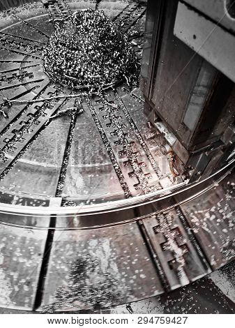 Photo Production Process Metal Processing With A Tool Cutter On A Circular Faceplate Of The Machine