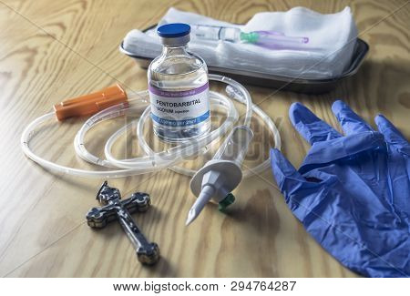 Vial With Doses Of Pentobarbital Next To A Crucifix, Debate Between Life And Death, Religious Belief