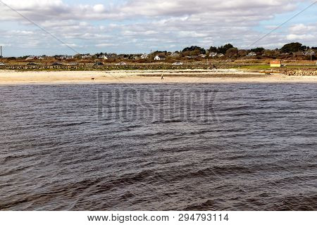 Beach With Sand And Buildings In Galway Bay