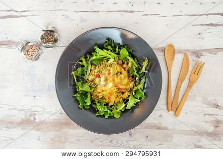 Salad made from radiatori cooked pasta, goat cheese and oil vinaigrette