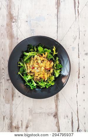 Salad made from radiatori cooked pasta, goat cheese and oil vinaigrette