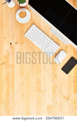 Desktop Computer. Top View Of Wooden Office Desk With Large Desktop Computer, Keyboard, Mouse, Smart