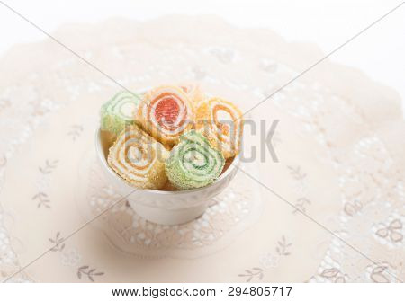 Bowl of turkish delight - Lokam. Turkish sweet rolls served in a small bowl.
