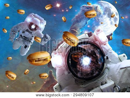 Astronauts In Outer Space With Cheseburgers On The  Pillar Of Creation And The Moon On The Backgroun
