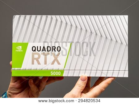 Paris France - Mar 28 2019: Senior Man Showing Cardboard Packaging Before Unboxing Of Nvidia Quadro 