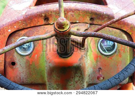 Steering Wheel On An Old, Colorful, Rusty Texas Tractor