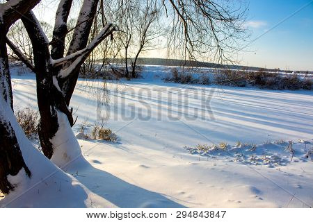 Panorama Of A Snow-covered River In A Winter Day
