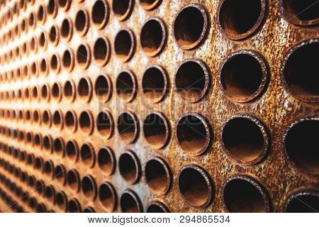 Rust Tube Sheet Of The Heat Exchanger For Maintenance, The Water Heater In The Boiler As Background 