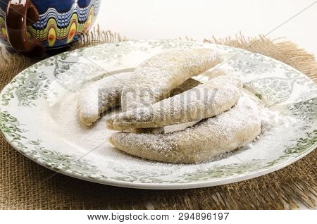Classic Vanilla Kipferl, Traditional German Cookies With Powdered Sugar On A Plate