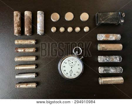 Corrosion-free Batteries.  Different Size And Shape.  A Broken Stopwatch. Recycling And Environmenta
