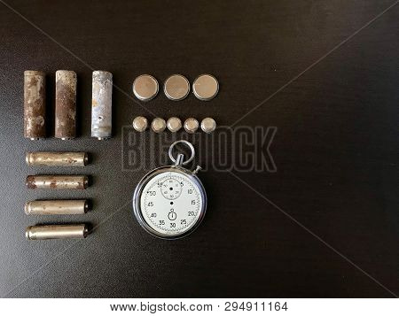 Corrosion-free Batteries.  Different Size And Shape.  A Broken Stopwatch. Recycling And Environmenta