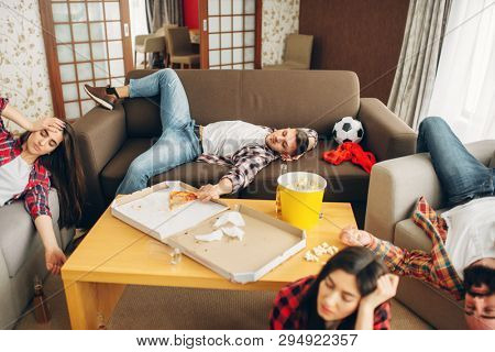 Football fans sleeping at home, hangover morning