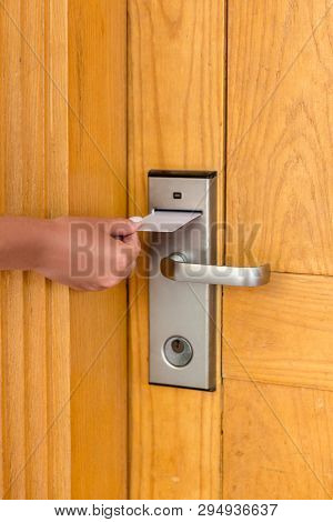 Woman Hand With Keycard In The Electronic Lock. Female Hand Hold Key Card And Open Electronic Lock D