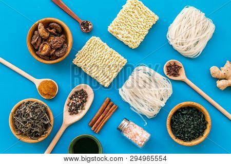 Rice Vermicelli, Noodles, Spices, Weeds Pattern To Cook Chinese And Japanese Food On Blue Background