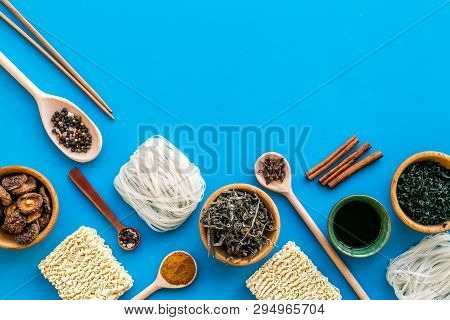 Rice Vermicelli, Noodles, Spices, Weeds Pattern To Cook Chinese And Japanese Food On Blue Background
