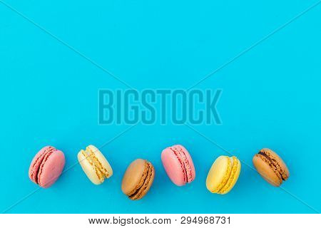 Brignt Macarons For Sweet Break On Blue Background Top View Mock Up