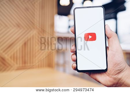 Chiang Mai, Thailand - Mar. 23,2019: Man Holding Xiaomi Mi Mix 3 With Youtube Apps On Screen. Youtub