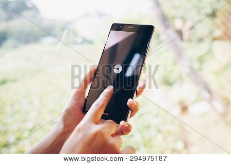 Chiang Mai, Thailand - Jan. 19,2019: Woman Holding Huawei With Uber Apps. Uber Is Smartphone App Tra