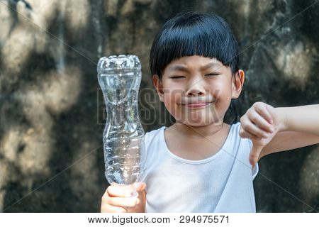 Asian Little Girl Is Holding Plastic Bottle