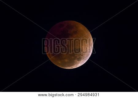 Blood Moon In The Lunar Eclipse And Also A Blue Moon And Super Moon Isolated On Black Background