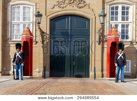 Copenhagen, Denmark - August 22, 2018: The Royal Guardsmen In The Traditional Uniform On Amalienborg