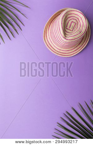 Straw Fashion Summer Hat Isolated On The Violet Or Puprle Backgound, Beach Summer Concept And Holida