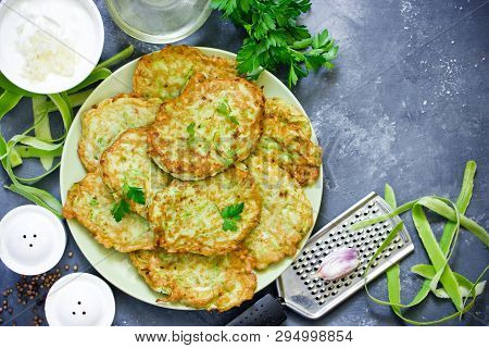 Pan Fried Zucchini Fritters, Traditional Flat Zucchini Pancakes With Garlic And Green Parsley